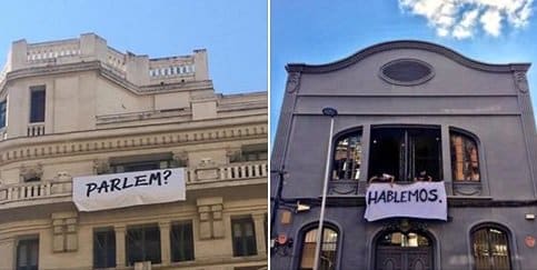 Pancartas colgadas en balcones de Madrid y Barcelona