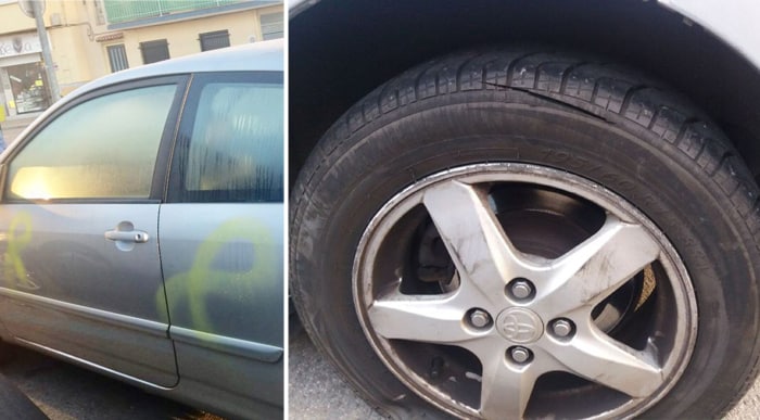 El coche de la militante de Ciudadanos, con pintadas de lazos amarillos y una rueda pinchada